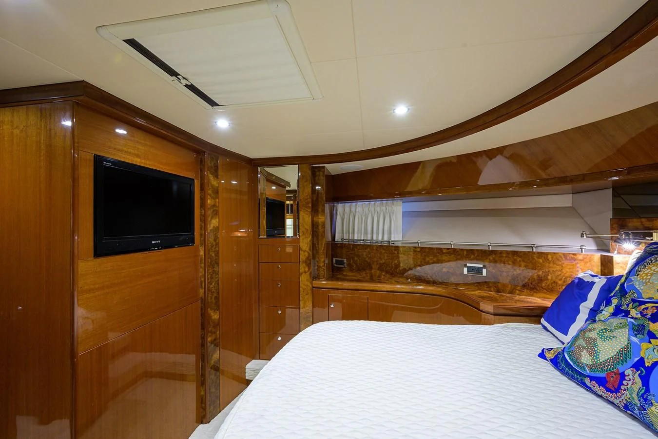 a bedroom with a wood ceiling aboard BARNSTAR Yacht for Sale