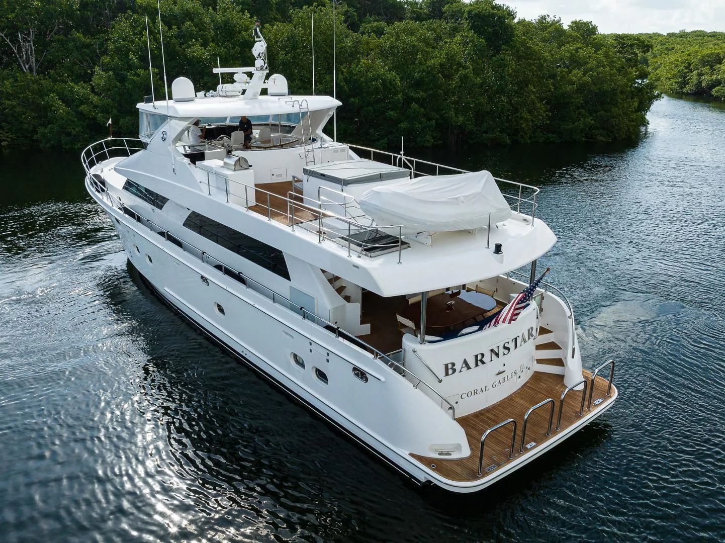 a white boat in the water aboard BARNSTAR Yacht for Sale