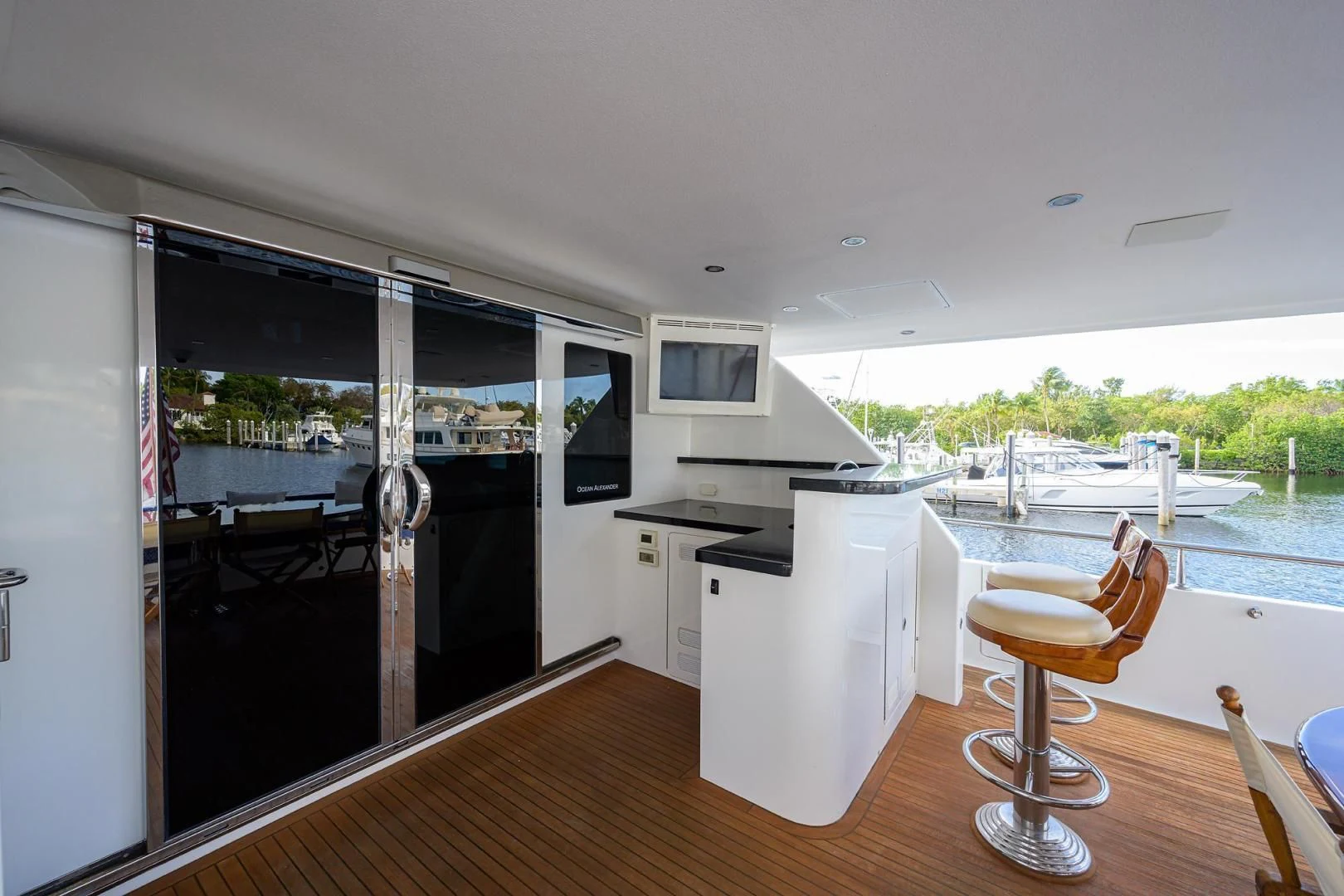 a kitchen with a large open door aboard BARNSTAR Yacht for Sale