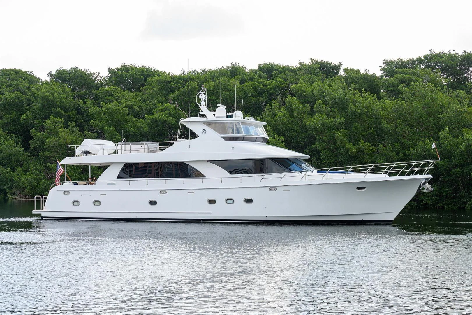 a white boat on water aboard BARNSTAR Yacht for Sale