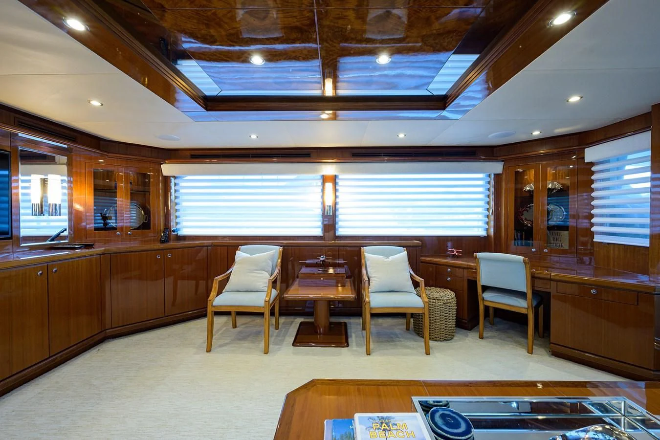 a room with a table chairs and a window aboard BARNSTAR Yacht for Sale