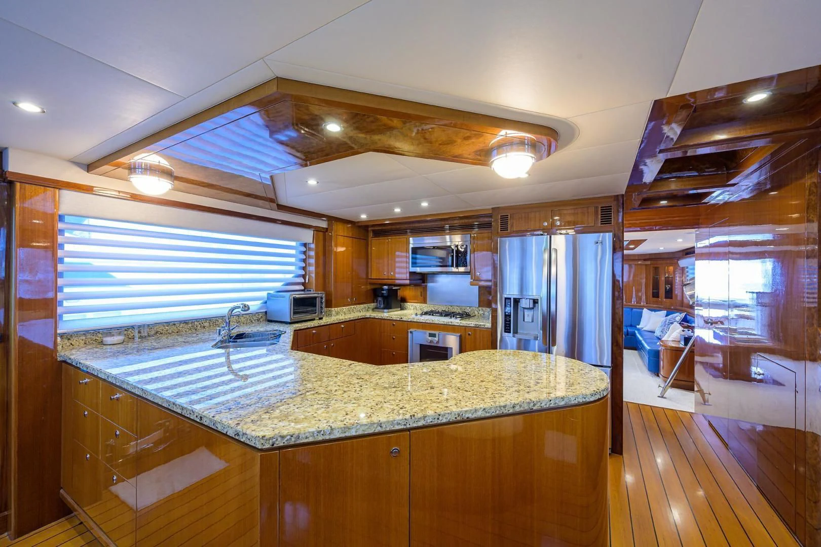 a kitchen with a large island aboard BARNSTAR Yacht for Sale