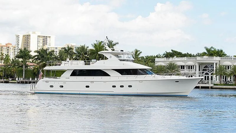 a large white boat in a harbor aboard BARNSTAR Yacht for Sale