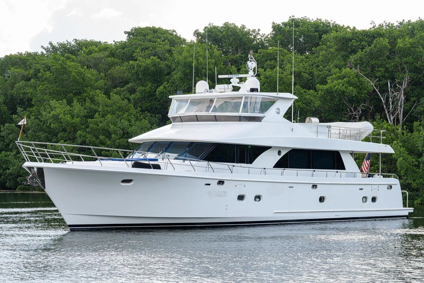 a white yacht on the water aboard BARNSTAR Yacht for Sale