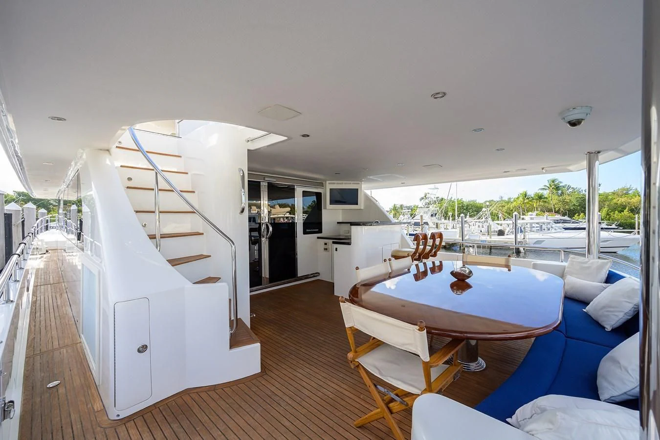 a large white house with a pool table and chairs aboard BARNSTAR Yacht for Sale