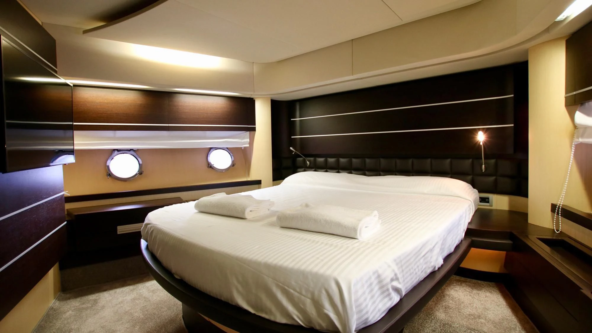 a room with a bed and a desk aboard ANCHE NO! Yacht for Sale