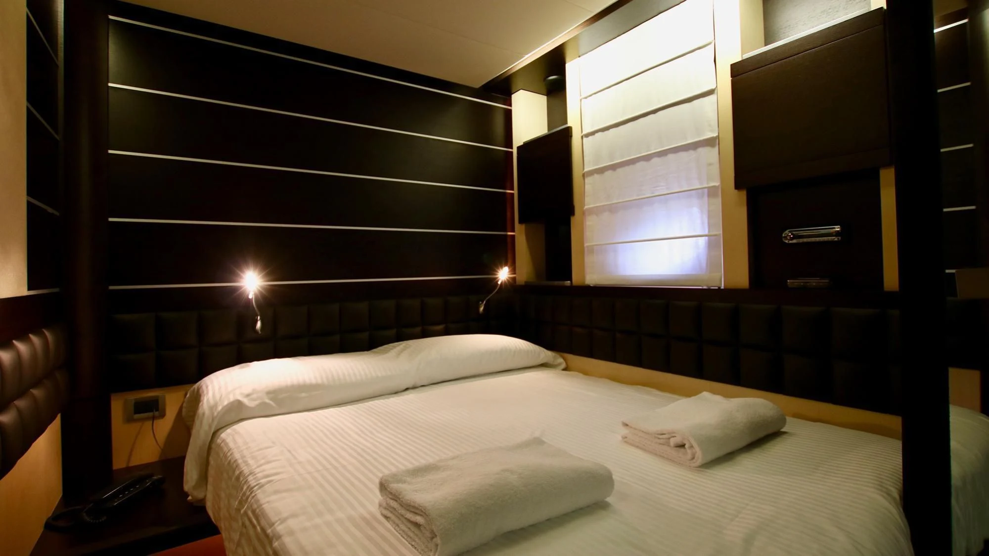 a bed with white sheets aboard ANCHE NO! Yacht for Sale