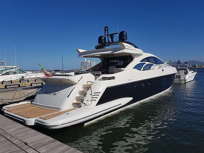 a boat docked at a pier aboard ANCHE NO! Yacht for Sale