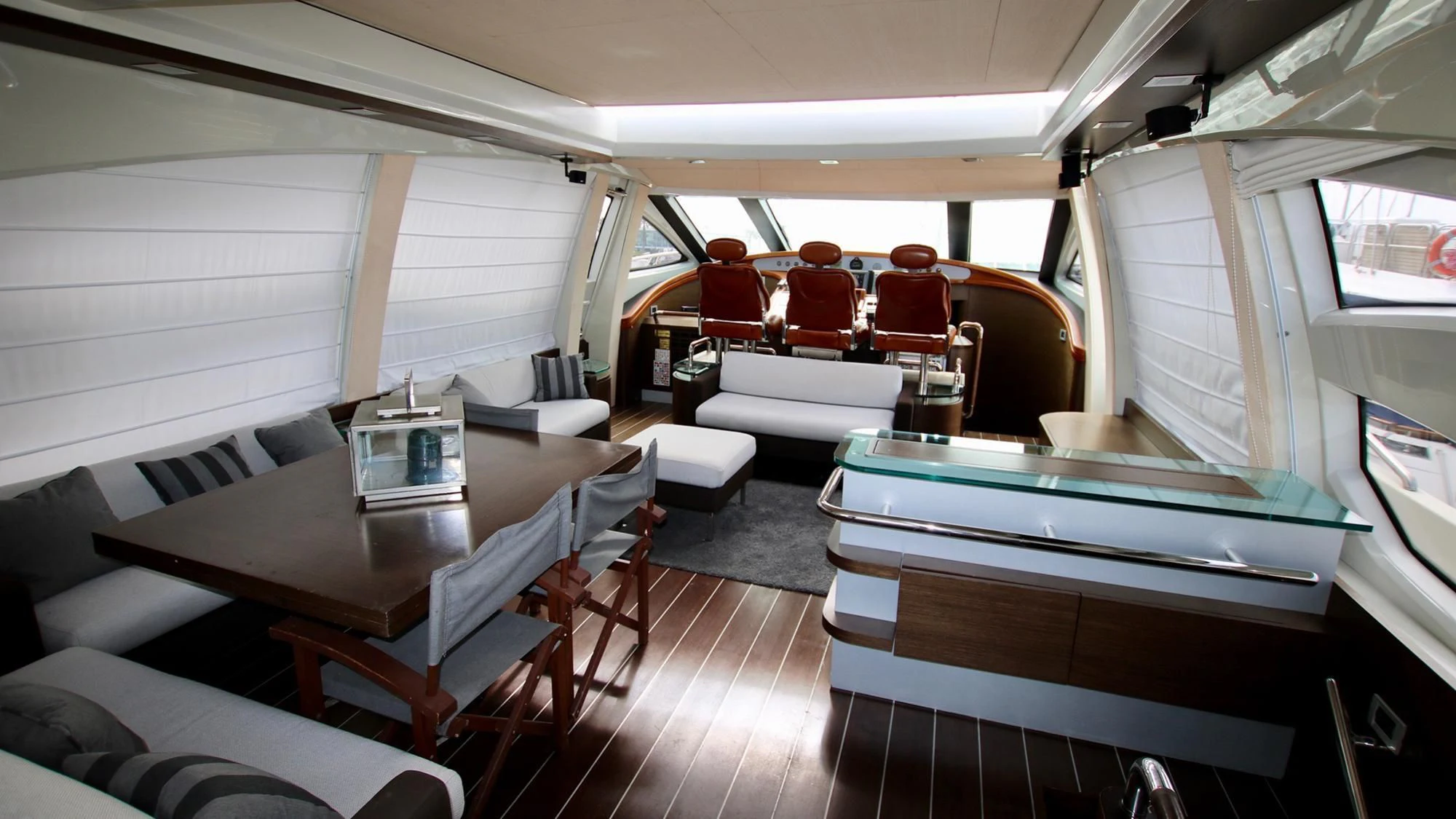inside of a vehicle with a table and chairs aboard ANCHE NO! Yacht for Sale