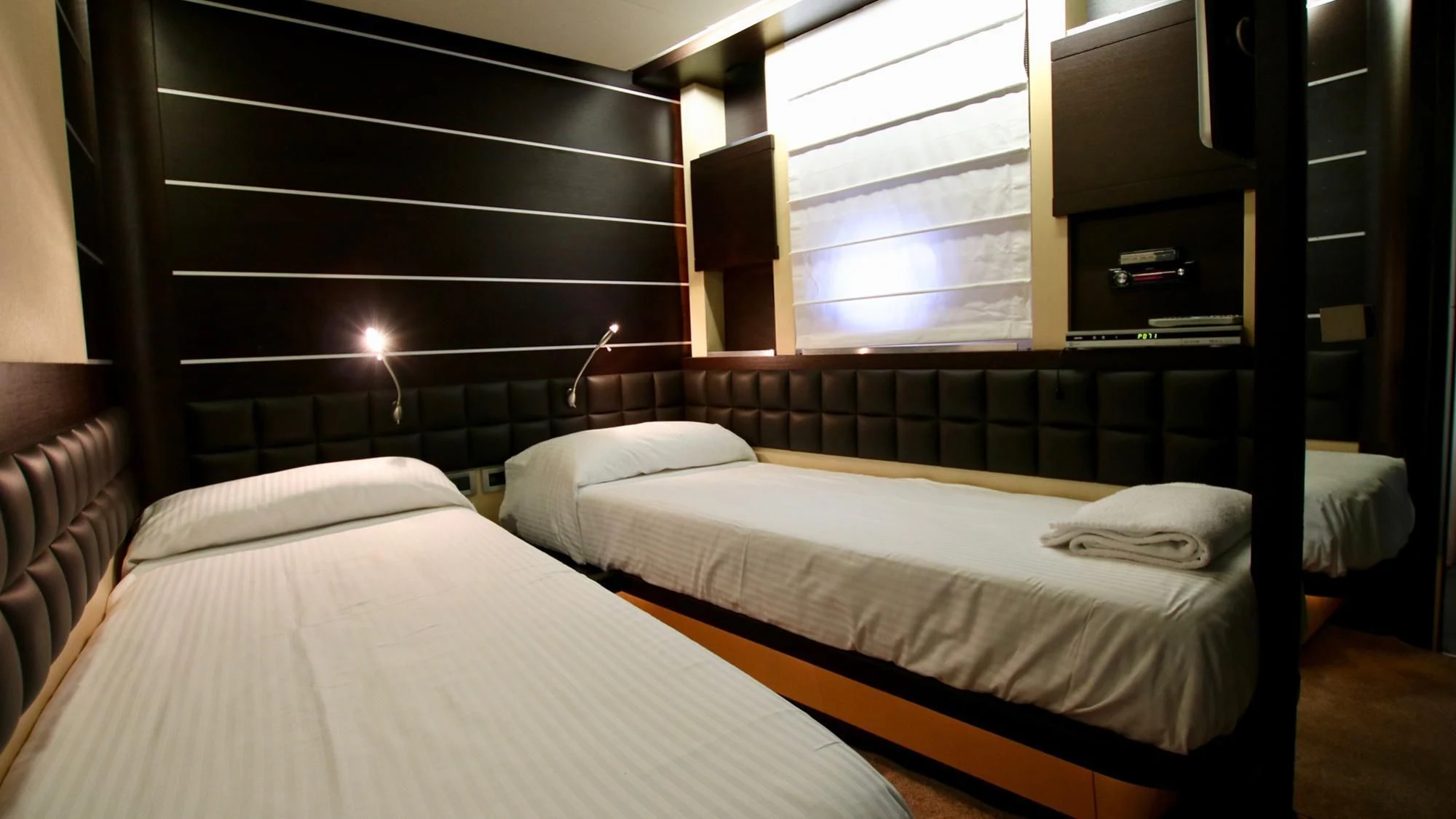 a room with two beds aboard ANCHE NO! Yacht for Sale
