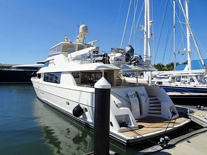 a boat docked at a pier aboard GRATITUDE Yacht for Sale