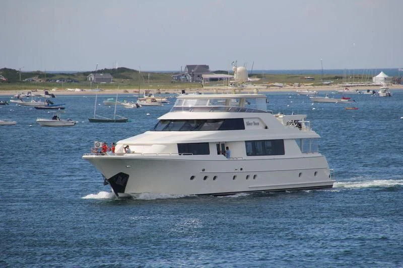 a white yacht in the water aboard GRATITUDE Yacht for Sale