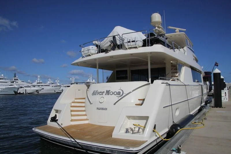 a large white boat on the water aboard GRATITUDE Yacht for Sale