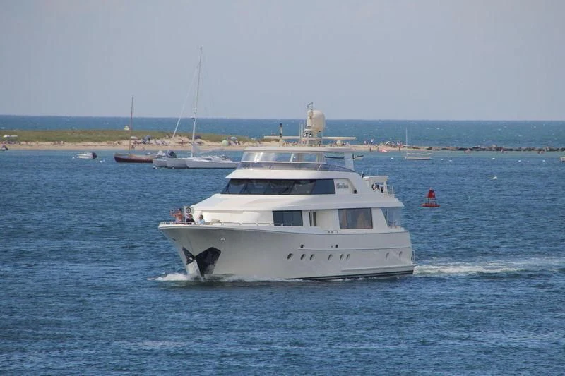 a white boat in the water aboard GRATITUDE Yacht for Sale