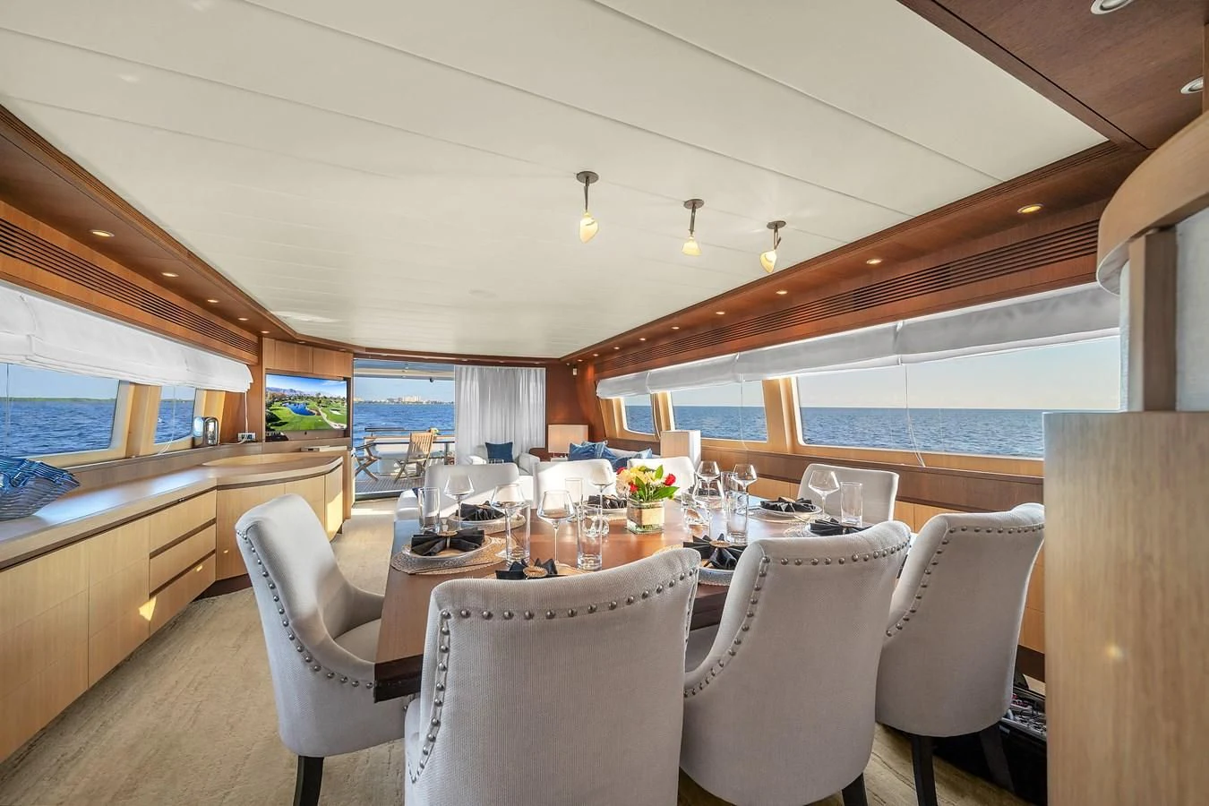 a dining room with a large table aboard DOMINIC Yacht for Sale