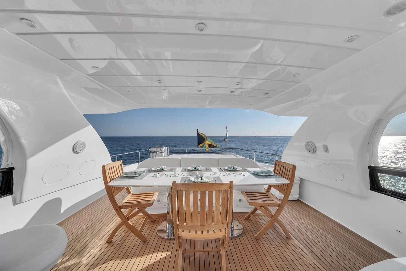 a room with a table and chairs aboard DOMINIC Yacht for Sale