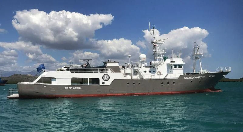 a large boat in the water aboard SHARKWATER Yacht for Sale
