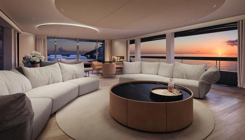 a living room with a large sofa and a coffee table aboard OCEAN ANGEL Yacht for Sale