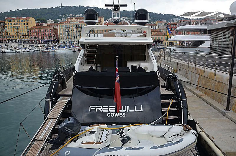 a boat docked at a pier aboard FREE WILLI Yacht for Sale