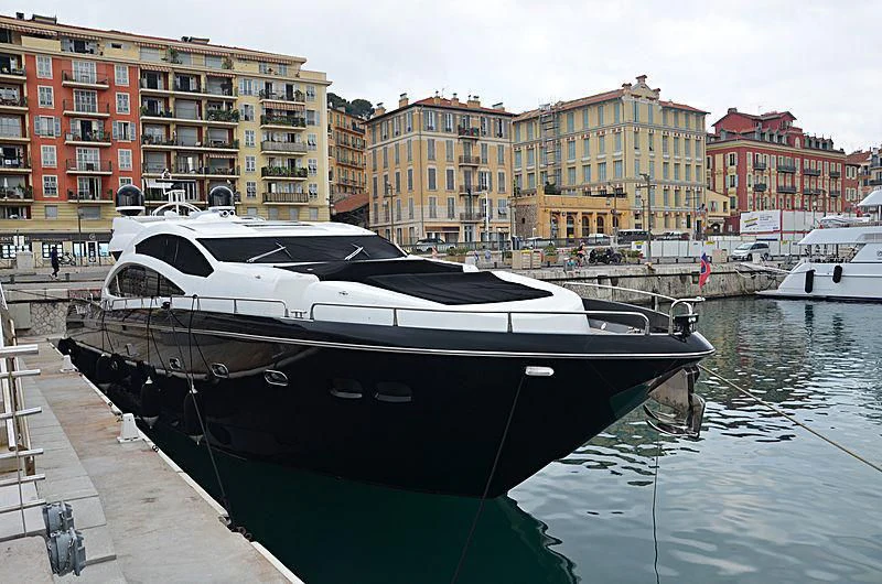 a boat docked at a pier aboard FREE WILLI Yacht for Sale