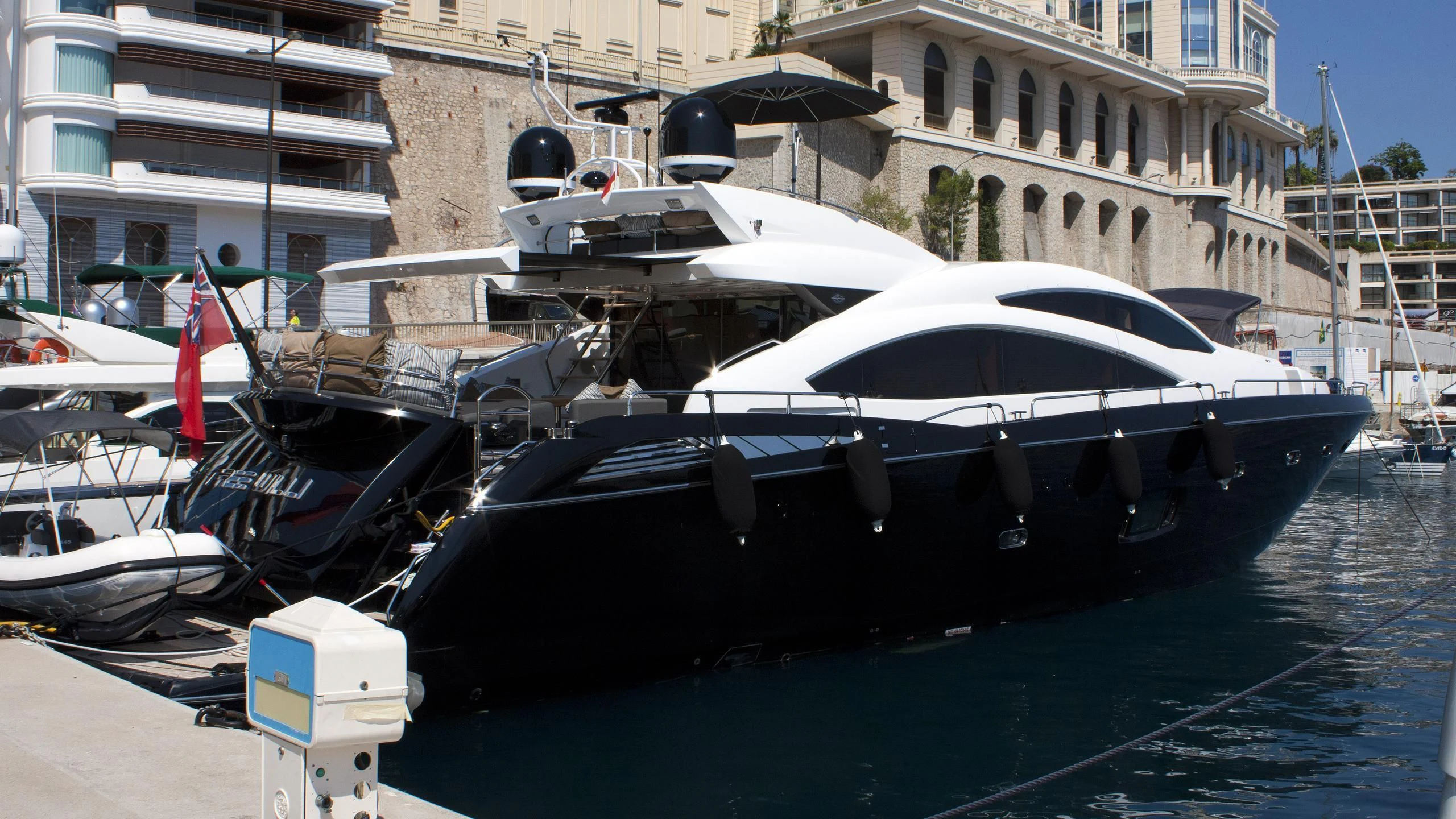a boat docked in a harbor aboard FREE WILLI Yacht for Sale