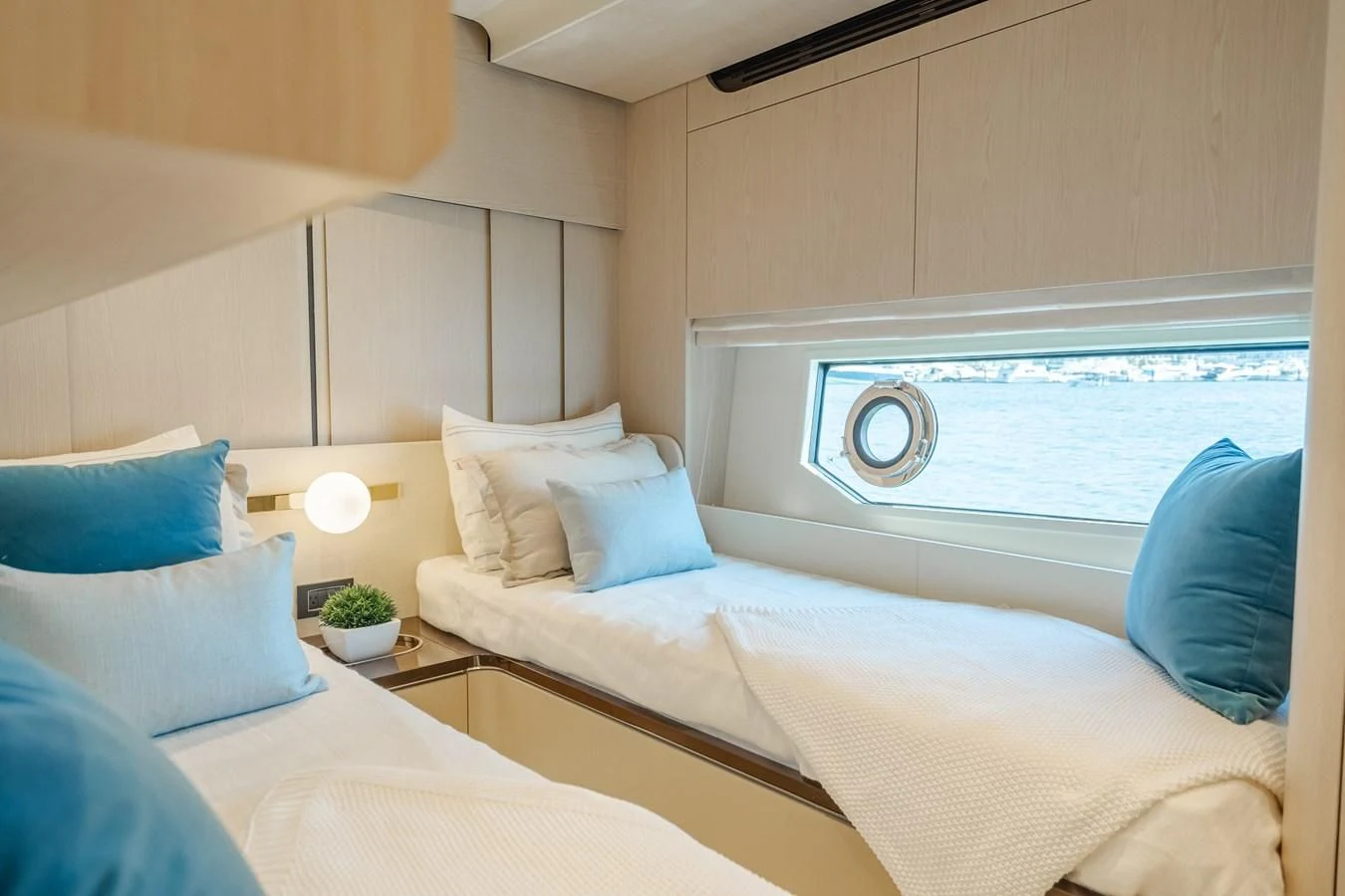 a room with a bed and a window aboard AZIMUT 25 METRI GRANDE Yacht for Sale