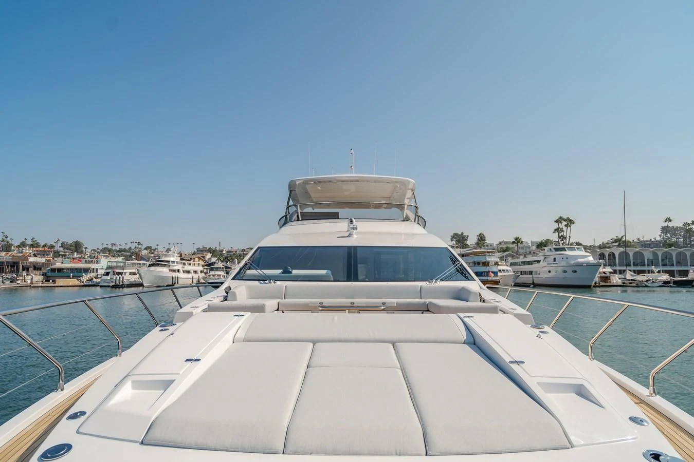a white yacht in a harbor aboard AZIMUT 25 METRI GRANDE Yacht for Sale