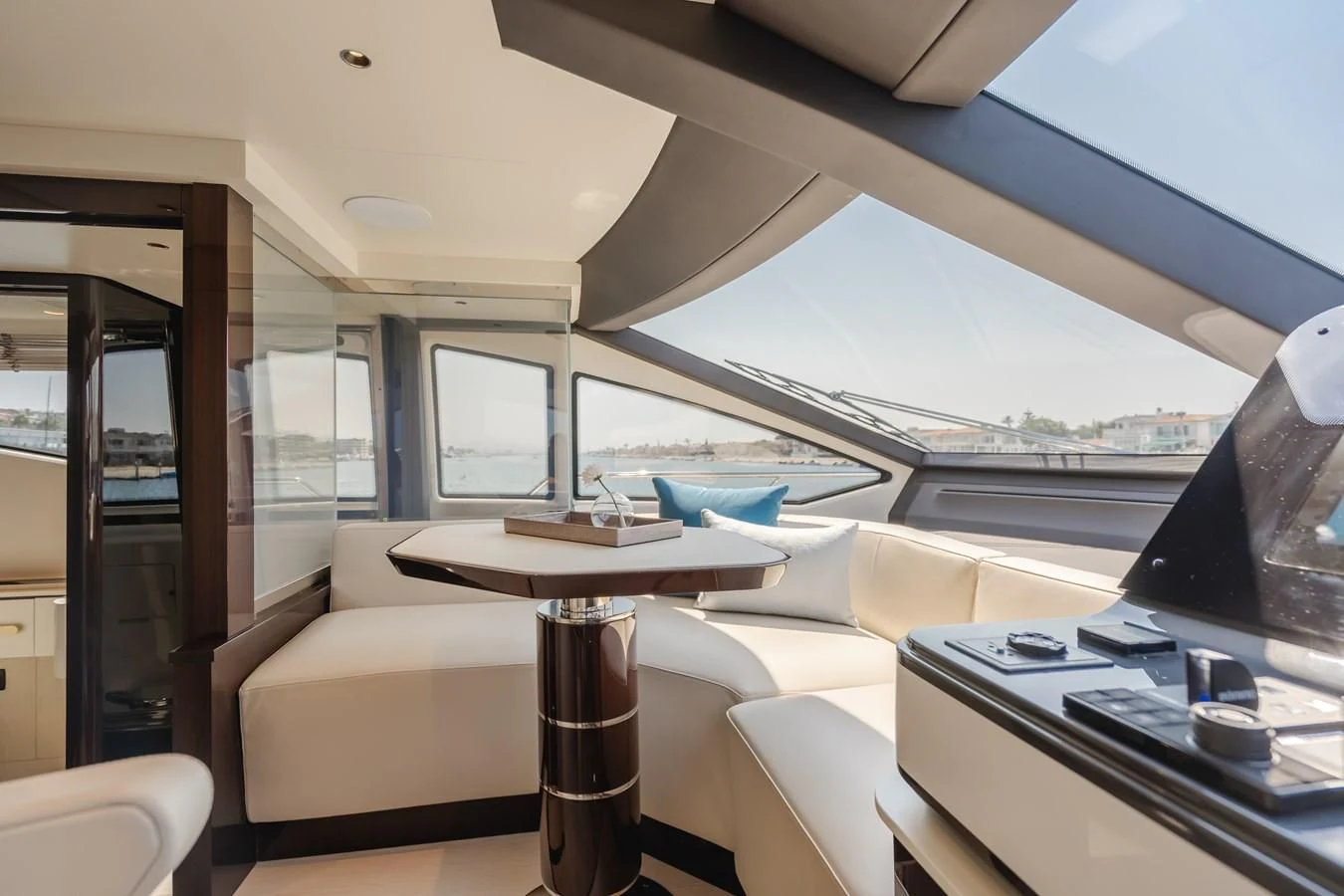 a room with a table and a window with a view of the water aboard AZIMUT 25 METRI GRANDE Yacht for Sale