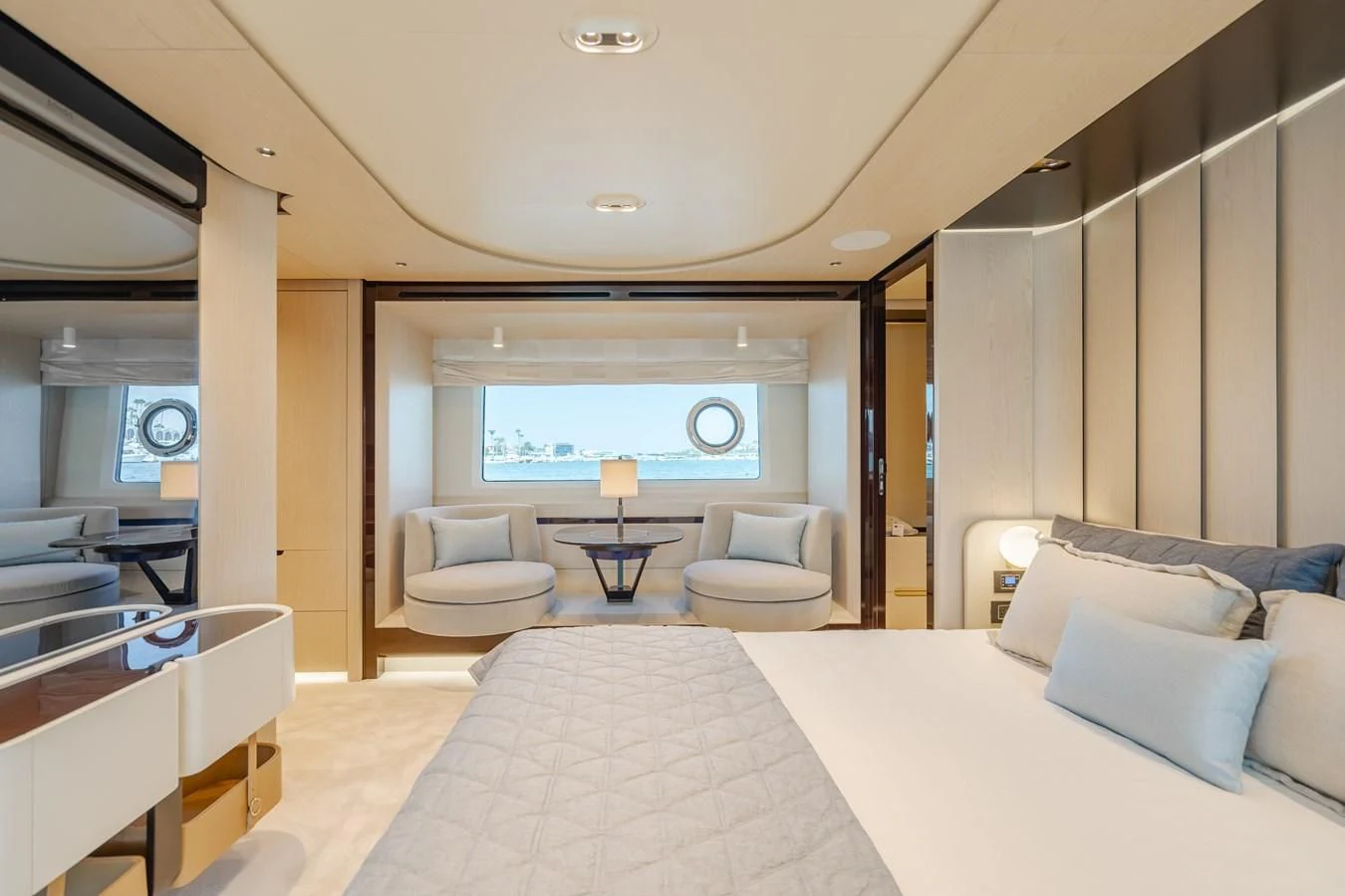 a room with a bed and a table aboard AZIMUT 25 METRI GRANDE Yacht for Sale