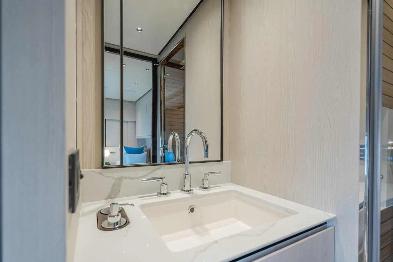 a bathroom with a sink and a mirror aboard AZIMUT 25 METRI GRANDE Yacht for Sale
