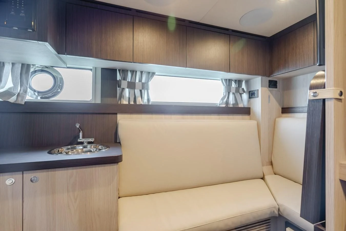 a kitchen with a sink and a couch aboard AZIMUT 25 METRI GRANDE Yacht for Sale