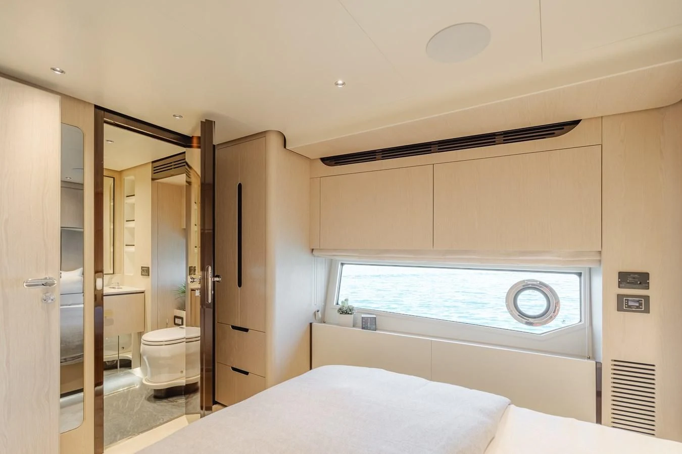a bedroom with a large window aboard AZIMUT 25 METRI GRANDE Yacht for Sale