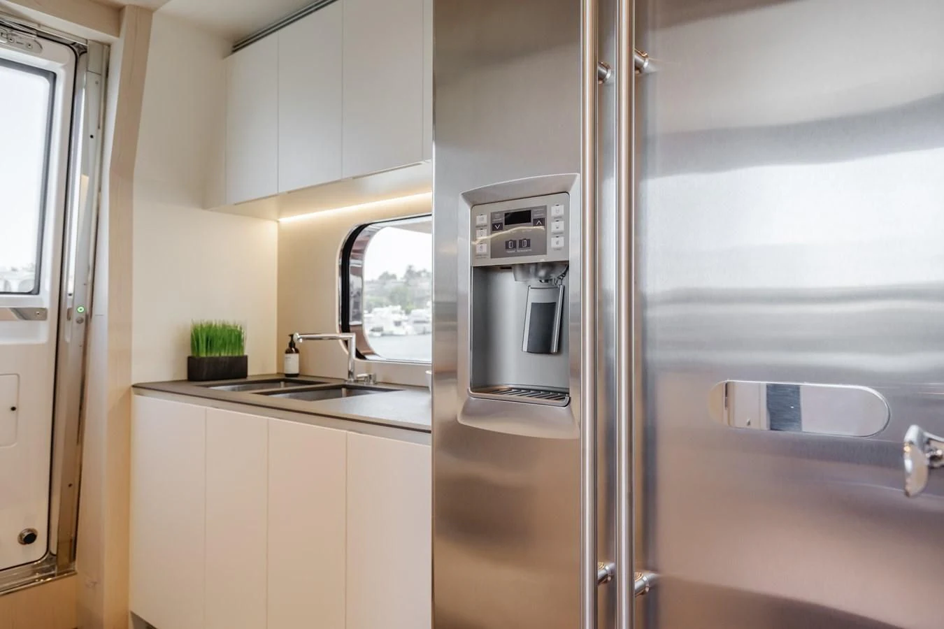 a stainless steel refrigerator in a kitchen aboard AZIMUT 25 METRI GRANDE Yacht for Sale
