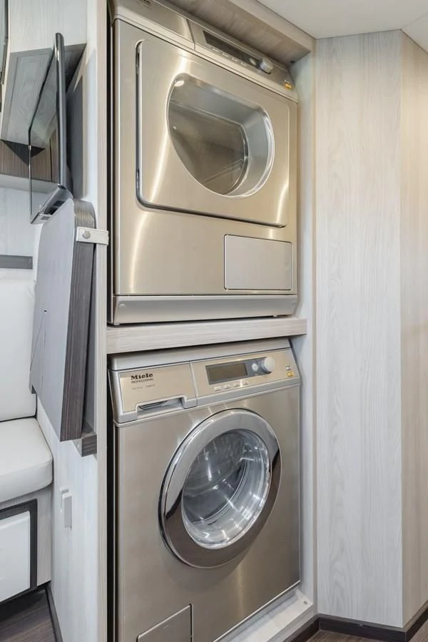 a washer and dryer in a room aboard AZIMUT 25 METRI GRANDE Yacht for Sale