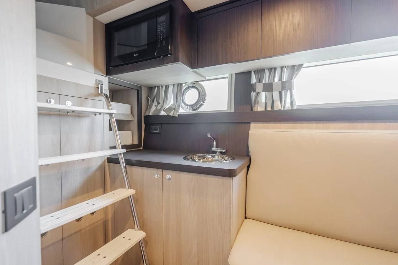 a kitchen with a microwave oven and a microwave aboard AZIMUT 25 METRI GRANDE Yacht for Sale