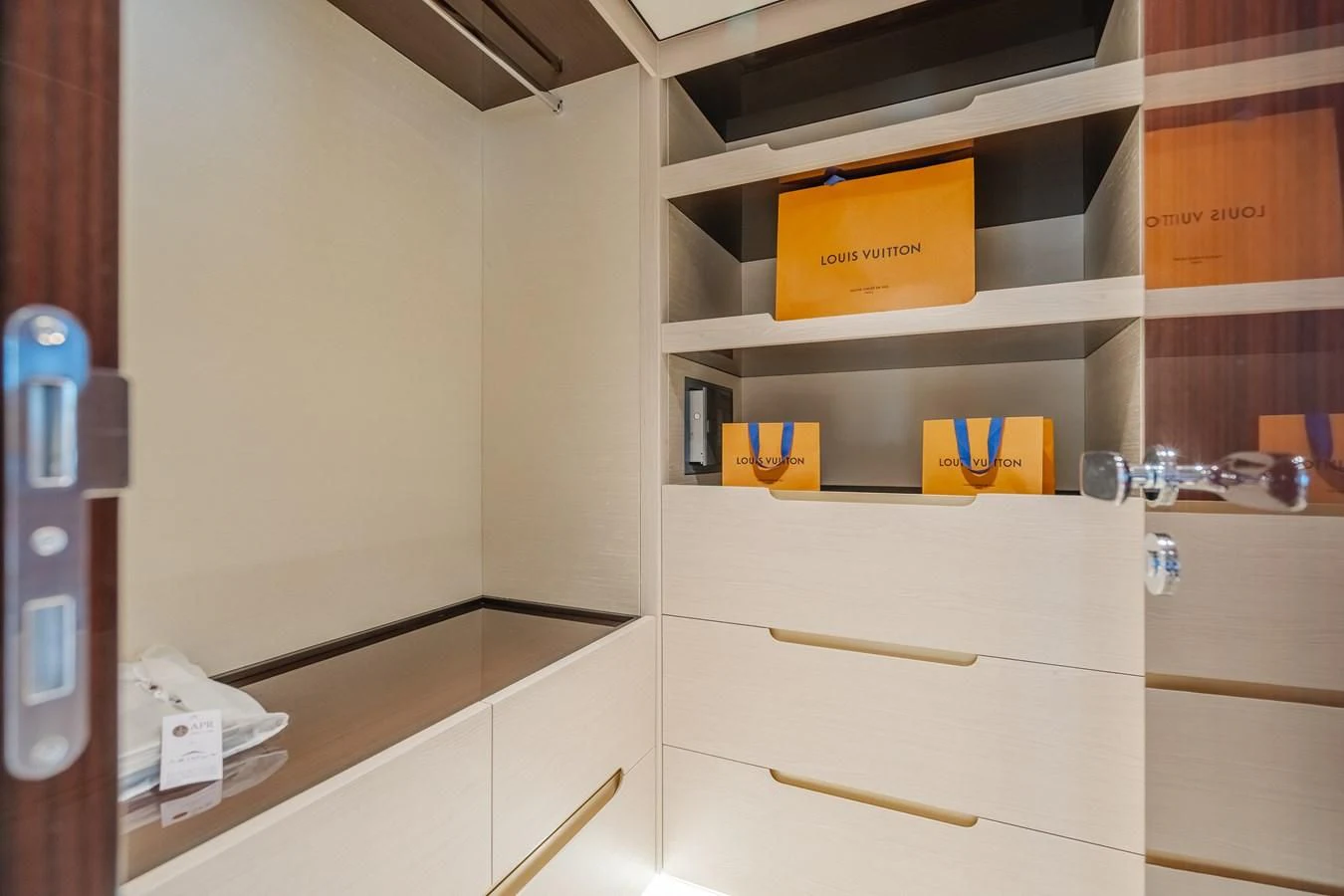a white cabinet with a yellow box on it aboard AZIMUT 25 METRI GRANDE Yacht for Sale