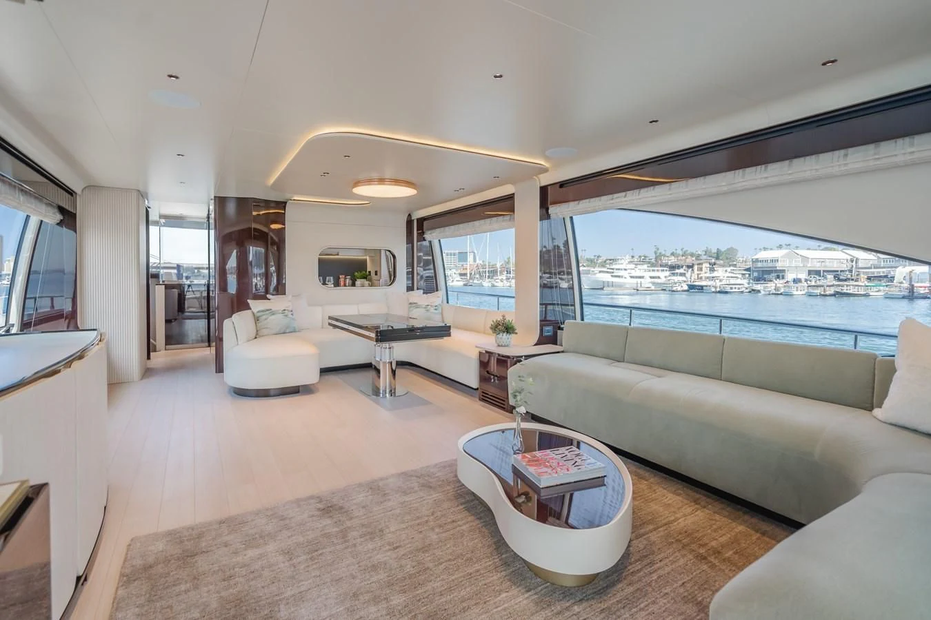 a living room with a large window aboard AZIMUT 25 METRI GRANDE Yacht for Sale