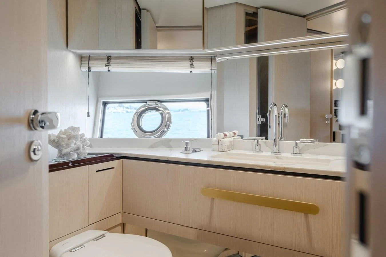a bathroom with a sink and a mirror aboard AZIMUT 25 METRI GRANDE Yacht for Sale