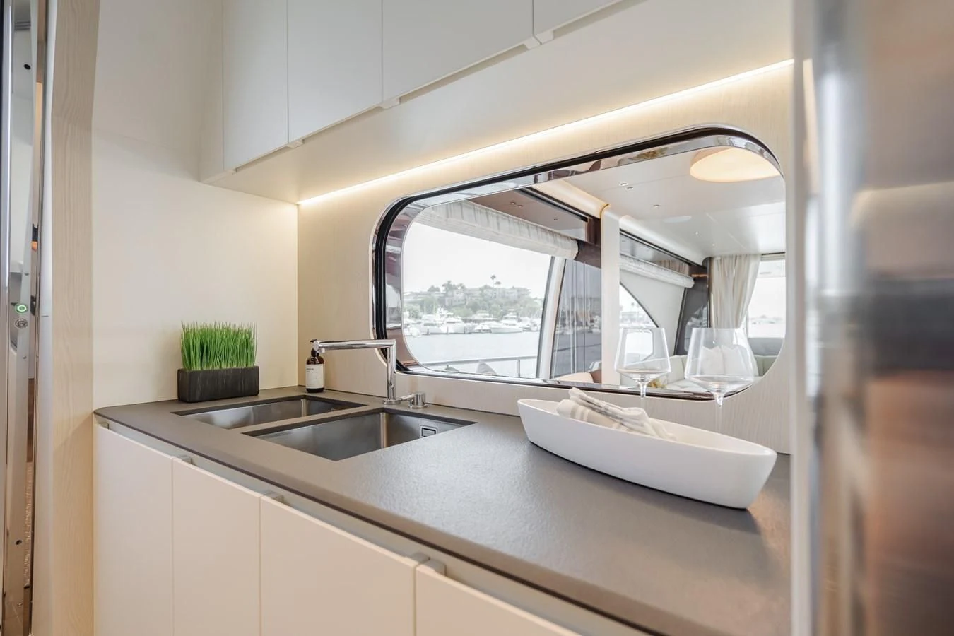 a kitchen with a large window aboard AZIMUT 25 METRI GRANDE Yacht for Sale