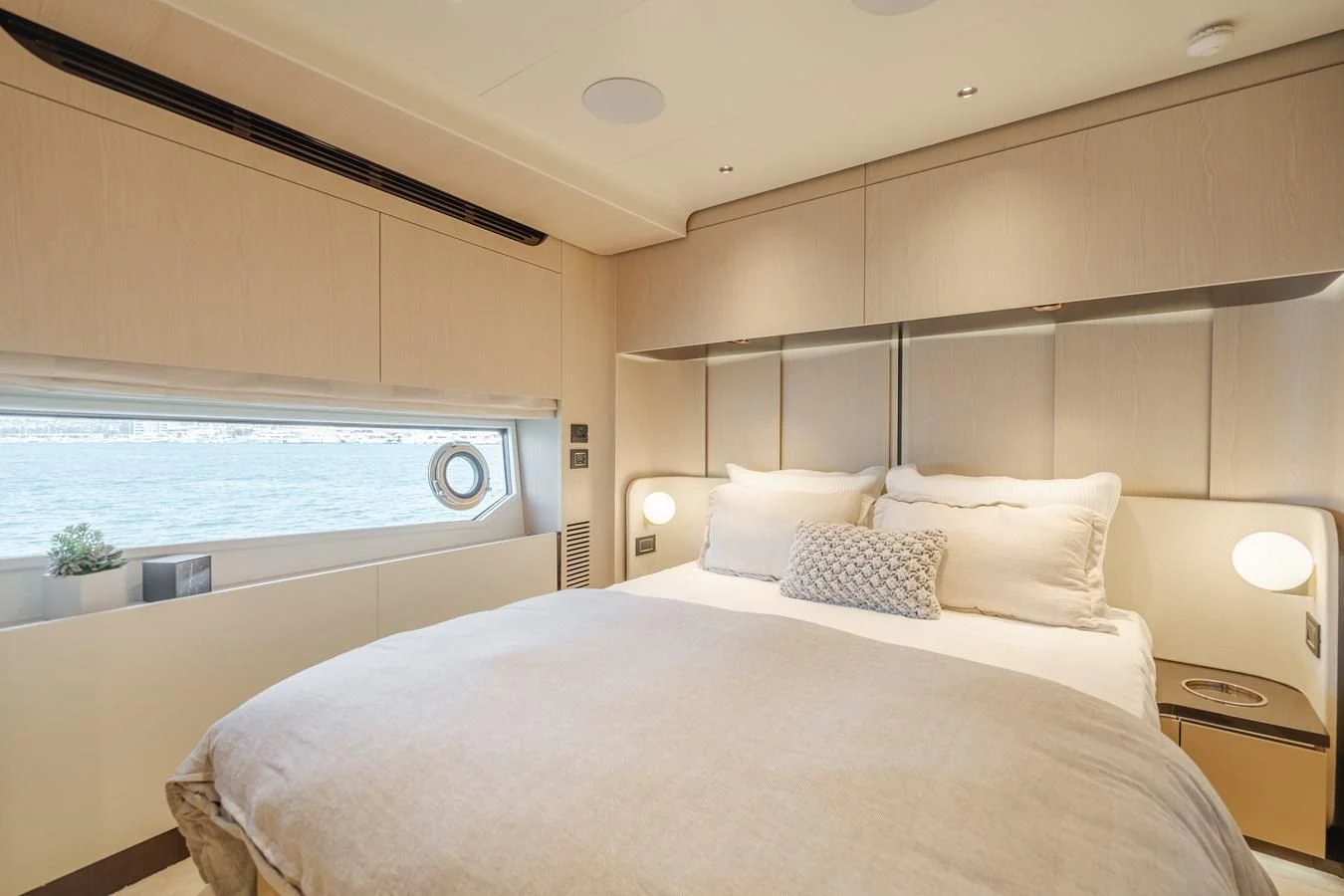 a room with a bed and a window aboard AZIMUT 25 METRI GRANDE Yacht for Sale