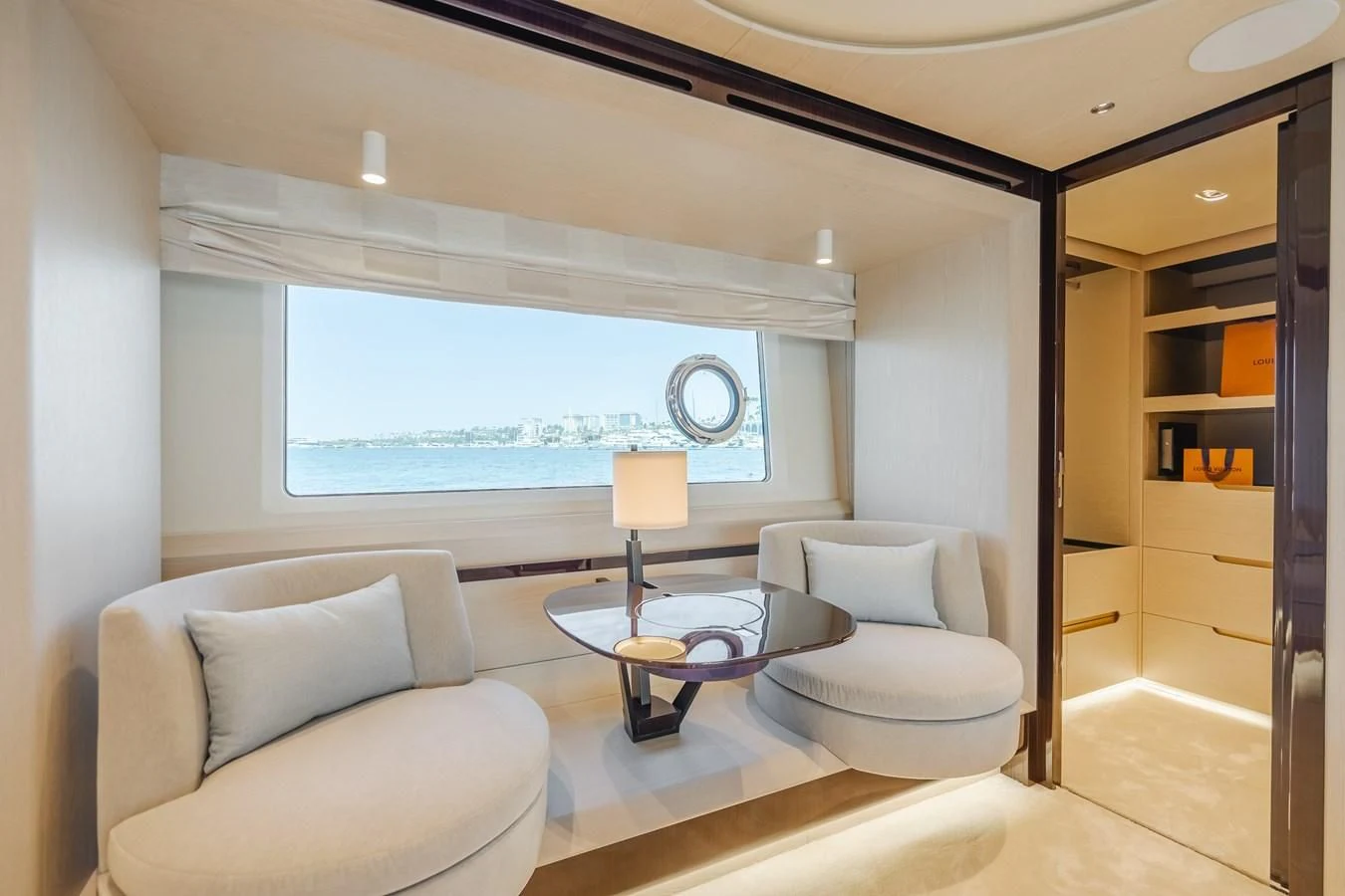 a living room with a large window aboard AZIMUT 25 METRI GRANDE Yacht for Sale