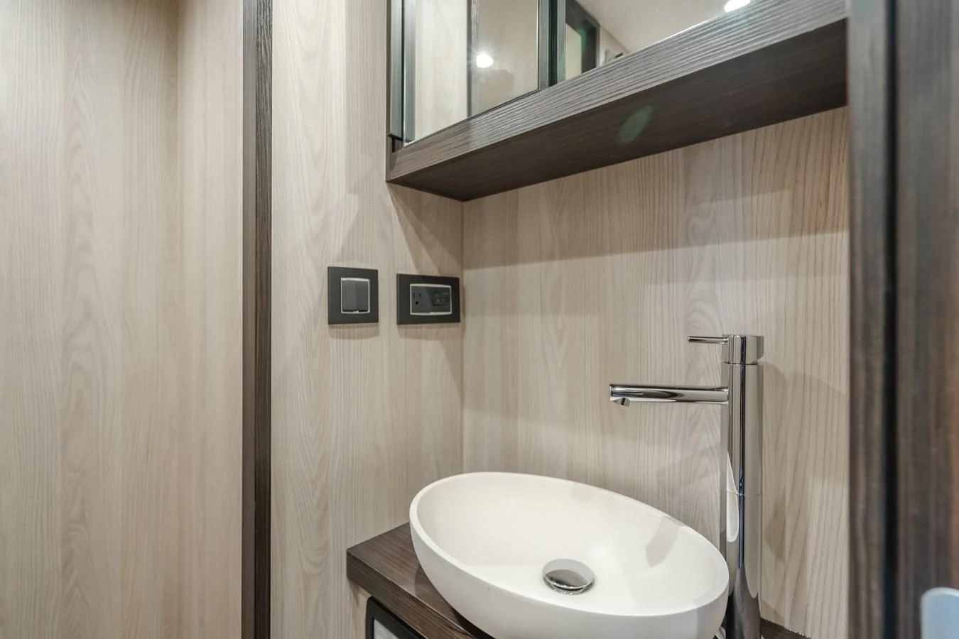 a sink and mirror in a bathroom aboard AZIMUT 25 METRI GRANDE Yacht for Sale