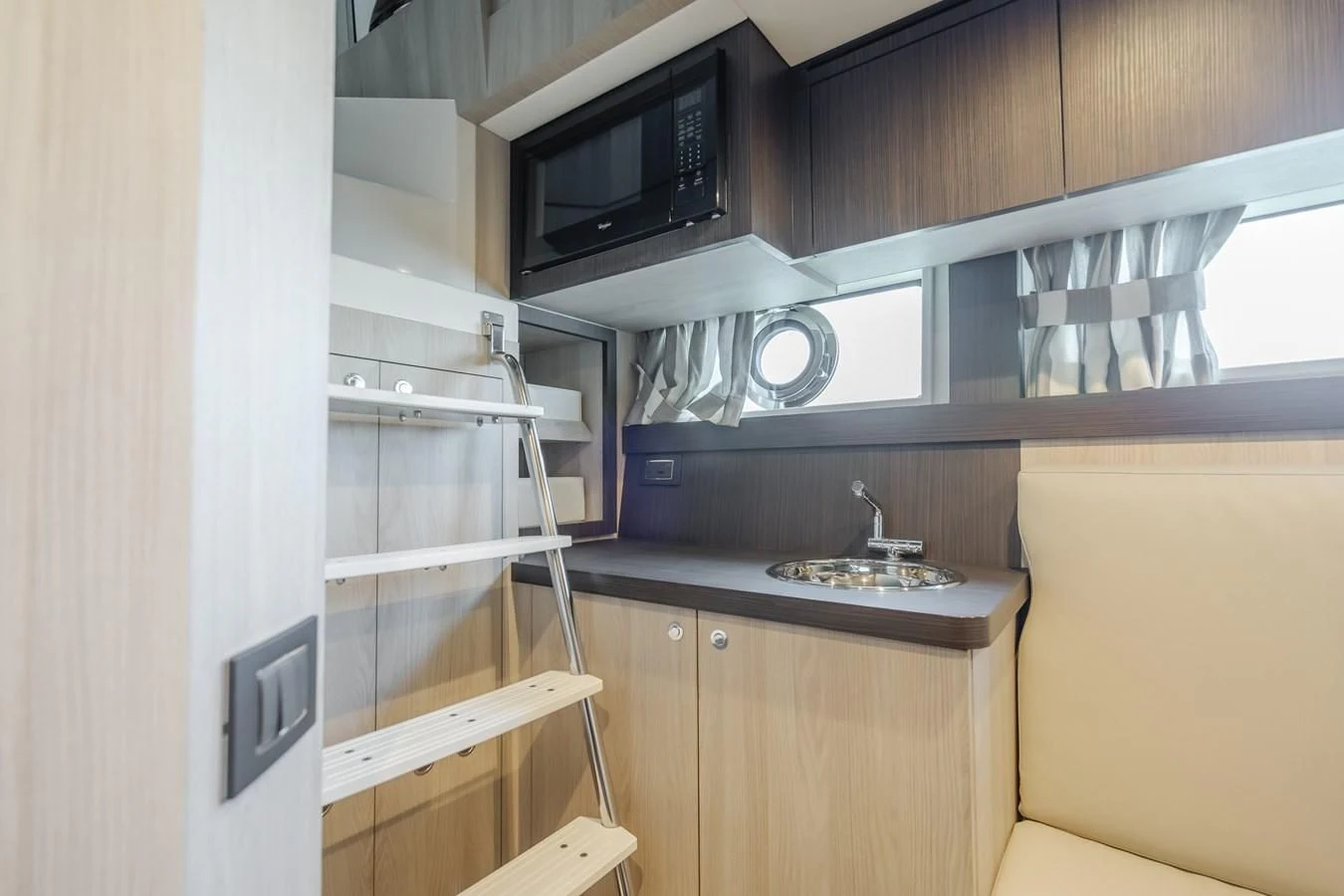 a kitchen with a microwave oven aboard AZIMUT 25 METRI GRANDE Yacht for Sale
