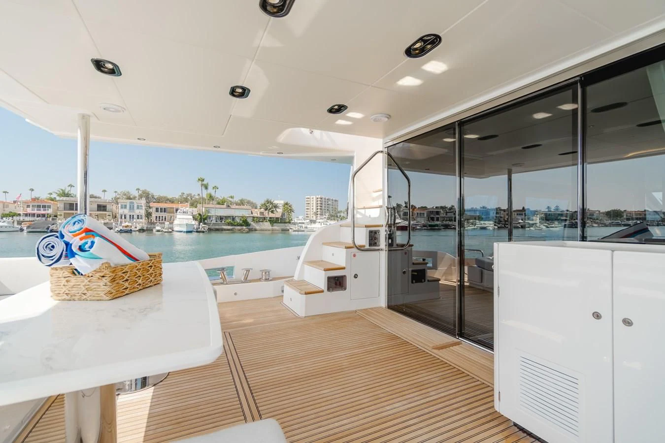 a room with a pool and a deck and a beach aboard AZIMUT 25 METRI GRANDE Yacht for Sale
