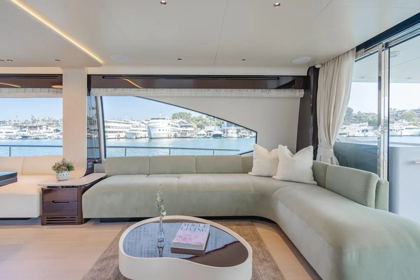a living room with a large window aboard AZIMUT 25 METRI GRANDE Yacht for Sale