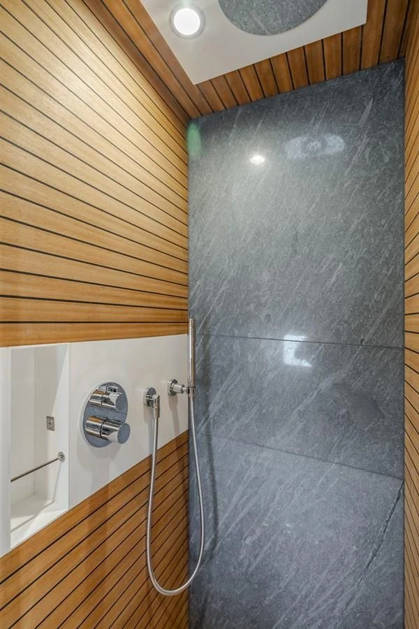 a shower with a tile wall aboard AZIMUT 25 METRI GRANDE Yacht for Sale