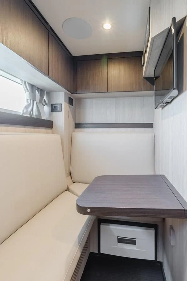 a small kitchen with a table aboard AZIMUT 25 METRI GRANDE Yacht for Sale
