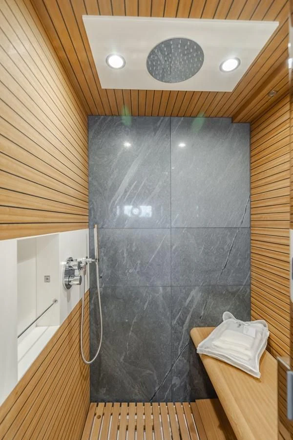 a shower with a tile wall aboard AZIMUT 25 METRI GRANDE Yacht for Sale