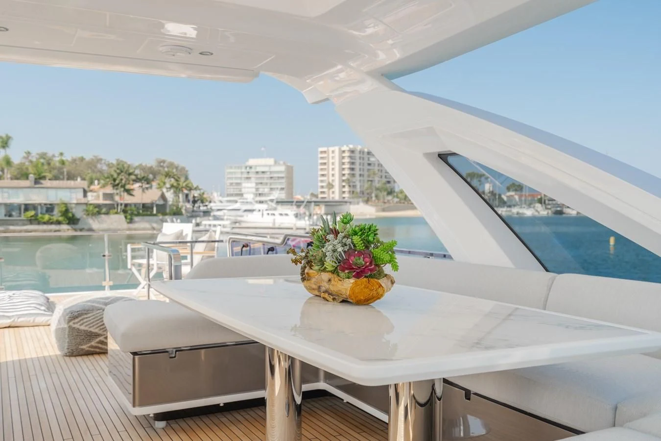 a table with a plant on it aboard AZIMUT 25 METRI GRANDE Yacht for Sale