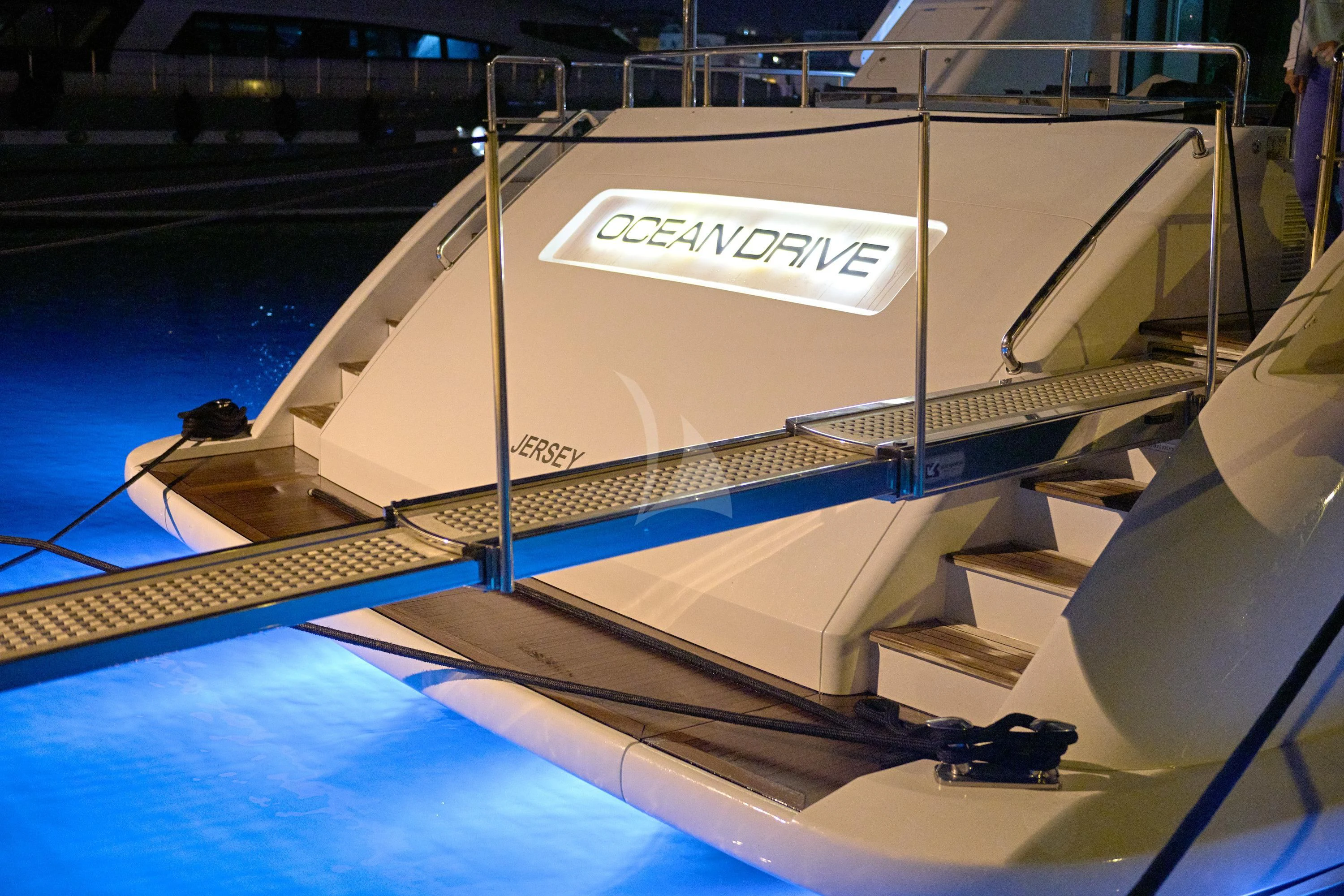 a white boat on a dock aboard OCEAN DRIVE Yacht for Charter